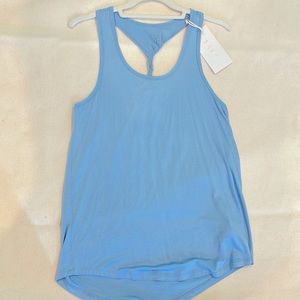 Soft wicking longer tank with racerback twist !